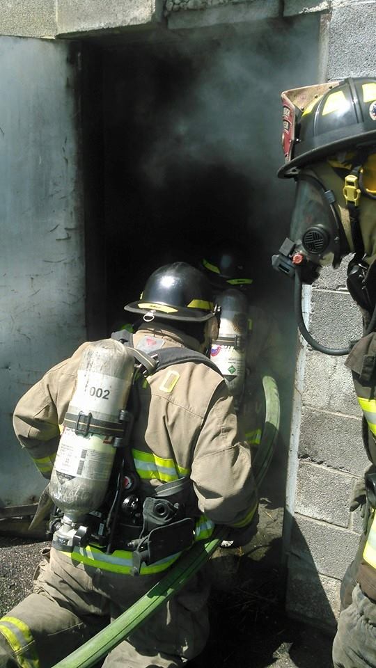 Firefighter Entering a Smokey Building