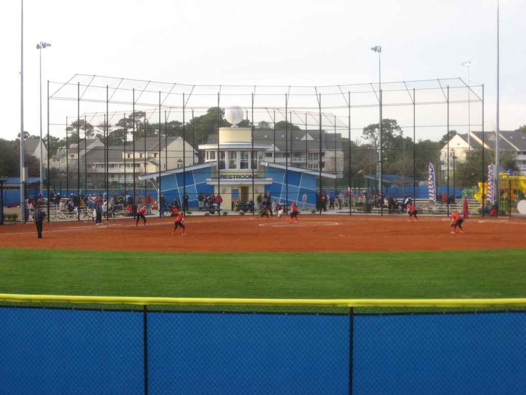 Softball Game Being Played on a Field